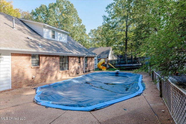 view of swimming pool featuring a patio