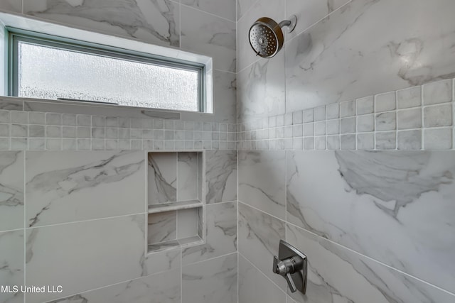 details featuring a tile shower