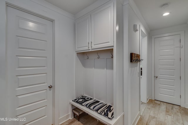 mudroom with light wood-type flooring and recessed lighting