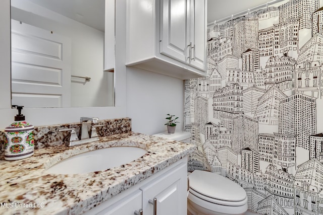 bathroom with vanity and toilet