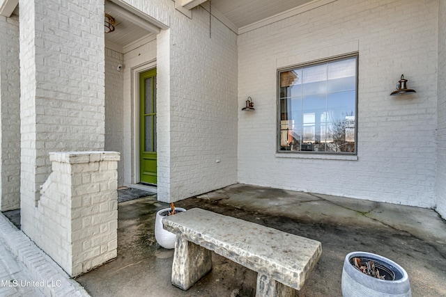 property entrance with brick siding