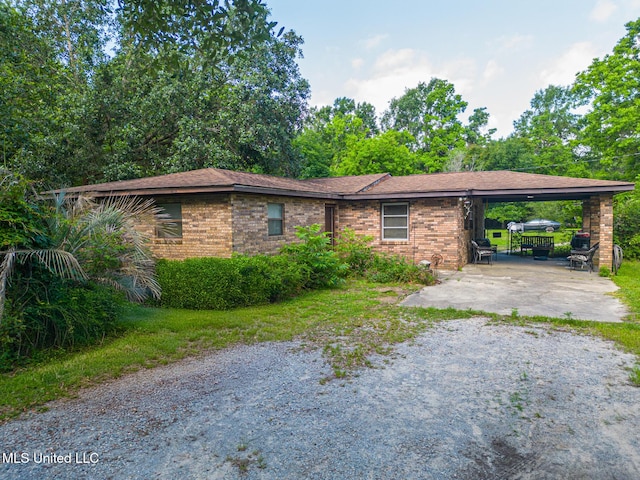 7041 Bosarge Rd, Long Beach, MS 39560 - single story home with driveway, a carport, and brick siding