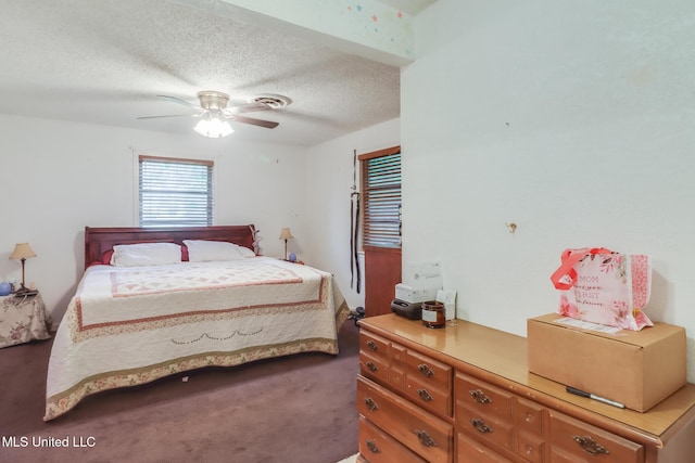7041 Bosarge Rd, Long Beach, MS 39560 - bedroom featuring a textured ceiling, carpet floors, and a ceiling fan