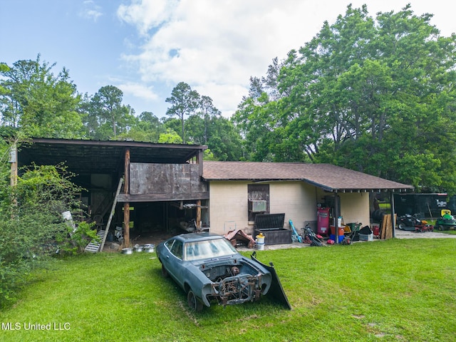 7041 Bosarge Rd, Long Beach, MS 39560 - rear view of property featuring concrete block siding and a yard