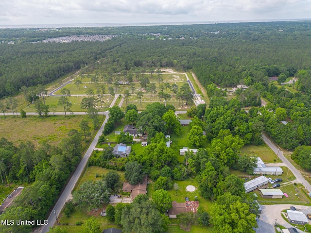 7041 Bosarge Rd, Long Beach, MS 39560 - aerial view of property and surrounding area featuring a heavily wooded area