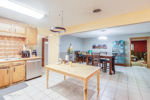 7041 Bosarge Rd, Long Beach, MS 39560 - kitchen featuring dishwasher, a sink, light countertops, and light tile patterned flooring