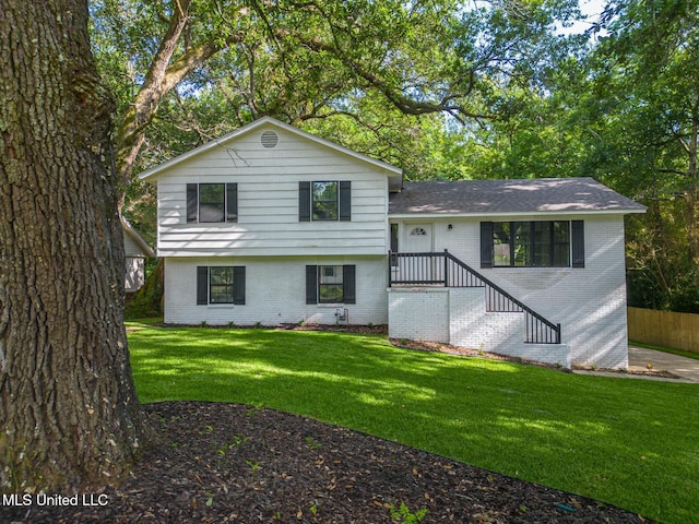 2550 Davidson Rd, Ocean Springs, MS 39564 - tri-level home with brick siding and a front yard