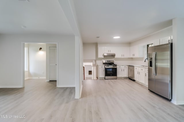 2550 Davidson Rd, Ocean Springs, MS 39564 - kitchen featuring appliances with stainless steel finishes, a sink, under cabinet range hood, white cabinets, and baseboards