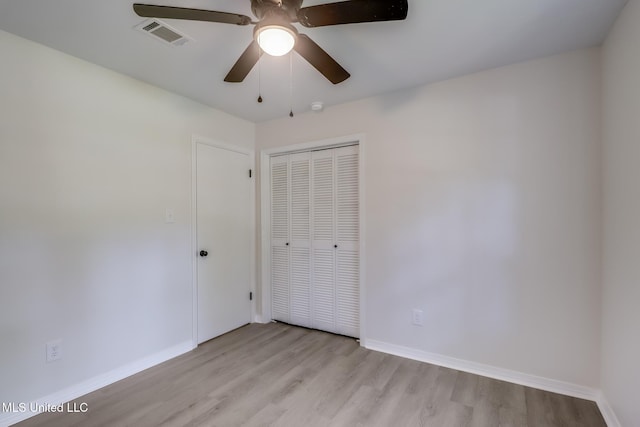 2550 Davidson Rd, Ocean Springs, MS 39564 - unfurnished bedroom featuring light wood finished floors, a closet, and baseboards