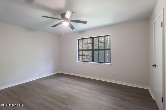 2550 Davidson Rd, Ocean Springs, MS 39564 - unfurnished room featuring dark wood-style flooring, ceiling fan, and baseboards