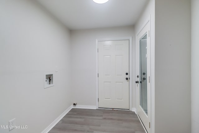 2550 Davidson Rd, Ocean Springs, MS 39564 - laundry area with wood finished floors, hookup for a washing machine, and baseboards