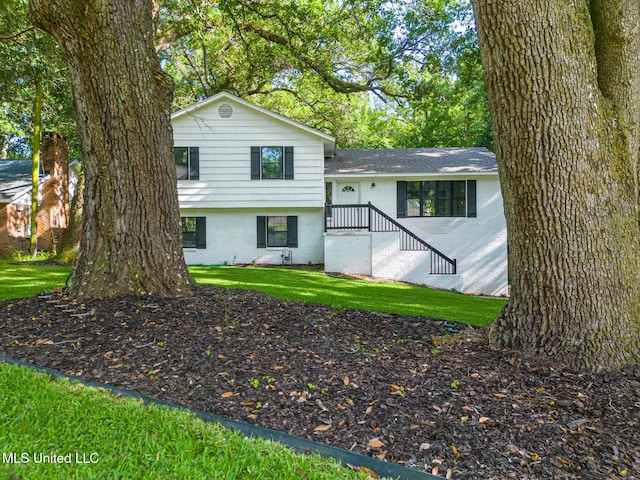 2550 Davidson Rd, Ocean Springs, MS 39564 - tri-level home featuring brick siding and a front lawn