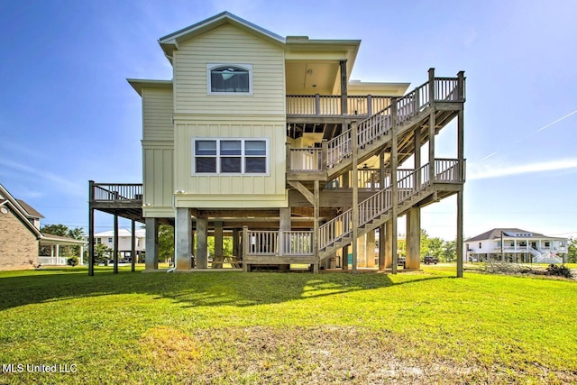 back of property featuring a yard and a deck