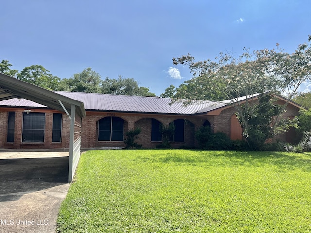 2285 Harkness Ct, Biloxi, MS 39532 - ranch-style home with metal roof, a front lawn, brick siding, and driveway