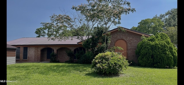 2285 Harkness Ct, Biloxi, MS 39532 - ranch-style home with a front yard, brick siding, and metal roof