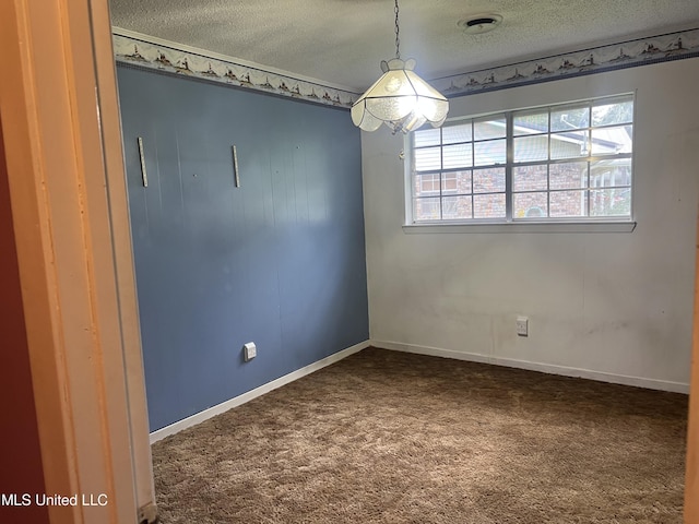 2285 Harkness Ct, Biloxi, MS 39532 - unfurnished room with a textured ceiling, dark colored carpet, and baseboards