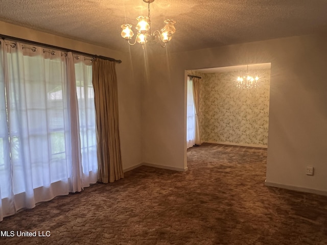 2285 Harkness Ct, Biloxi, MS 39532 - unfurnished room featuring a chandelier, dark colored carpet, a textured ceiling, and baseboards