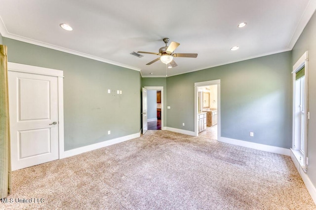 unfurnished bedroom featuring ensuite bathroom, ceiling fan, light carpet, and ornamental molding