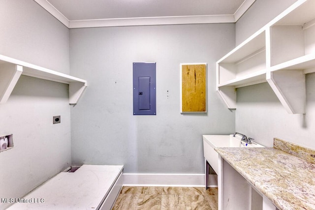 laundry area with hookup for an electric dryer, electric panel, and ornamental molding