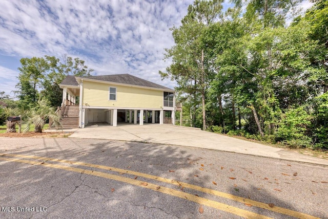 view of front of home with a carport