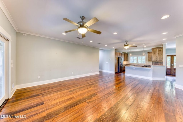 unfurnished living room with crown molding, dark hardwood / wood-style flooring, and ceiling fan