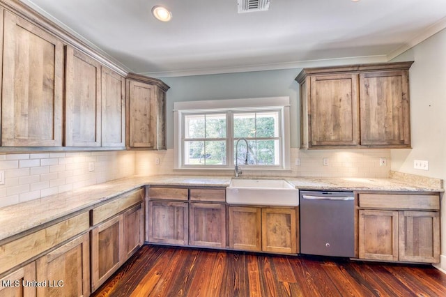 kitchen with tasteful backsplash, dark hardwood / wood-style flooring, dishwasher, and sink