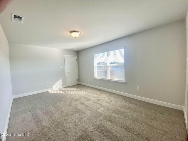 view of carpeted spare room