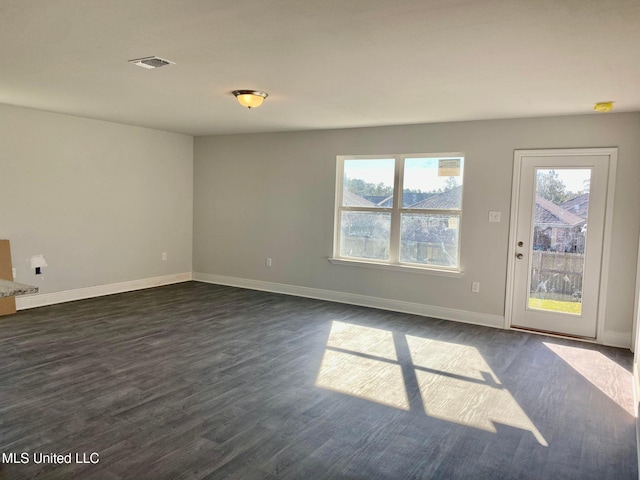 unfurnished room with dark hardwood / wood-style floors