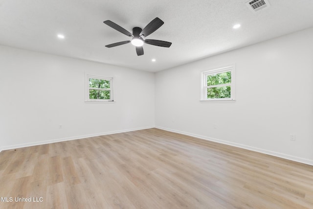3917 Wildwood Rd, Moss Point, MS 39562 - empty room featuring plenty of natural light, recessed lighting, light wood-style floors, and a ceiling fan