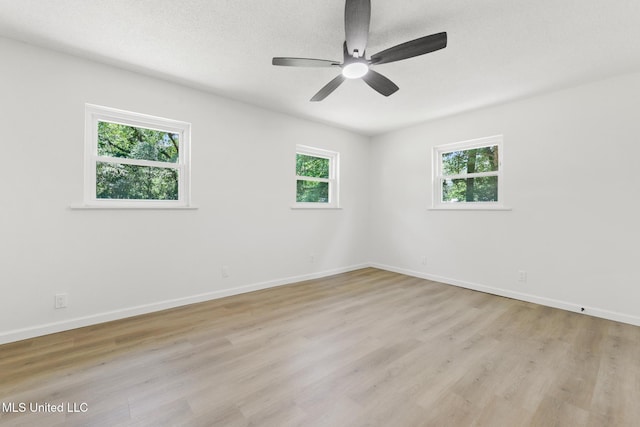 3917 Wildwood Rd, Moss Point, MS 39562 - empty room with light wood finished floors and a ceiling fan