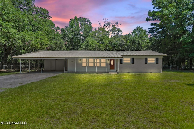 3917 Wildwood Rd, Moss Point, MS 39562 - single story home featuring crawl space, driveway, an attached carport, and a metal roof