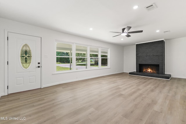 3917 Wildwood Rd, Moss Point, MS 39562 - unfurnished living room featuring recessed lighting, a brick fireplace, ceiling fan, and light wood finished floors