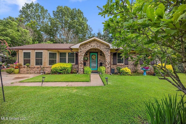 ranch-style home with a front lawn