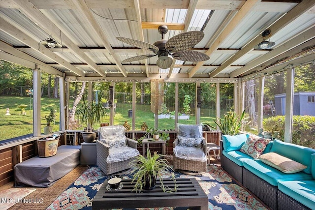 sunroom featuring ceiling fan