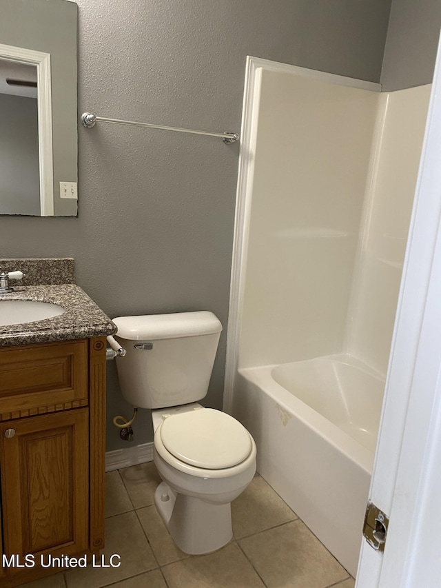 full bathroom with shower / tub combination, tile patterned floors, vanity, and toilet