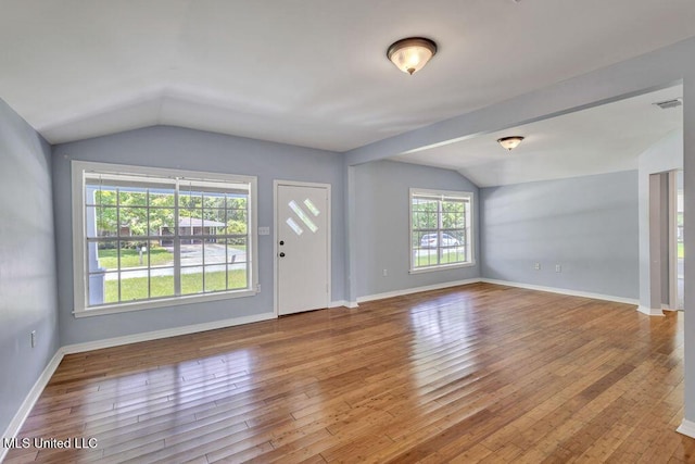 entryway featuring vaulted ceiling and light hardwood / wood-style floors