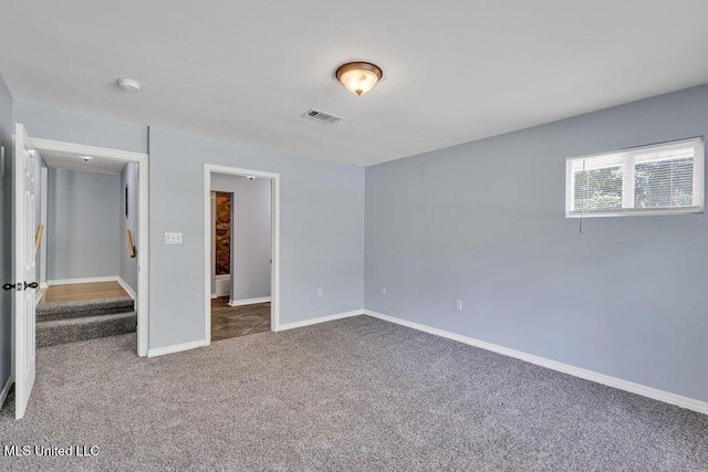 unfurnished bedroom featuring carpet