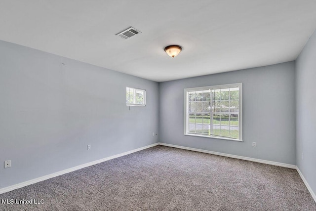 unfurnished room with carpet flooring