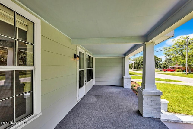 view of patio featuring a porch