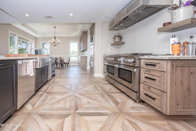 kitchen with appliances with stainless steel finishes, open shelves, under cabinet range hood, and a raised ceiling