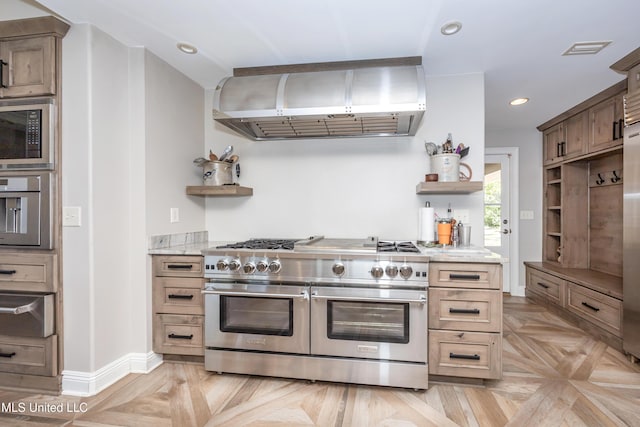 kitchen with stainless steel appliances, open shelves, visible vents, and wall chimney exhaust hood