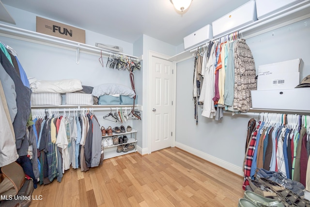 spacious closet with wood finished floors