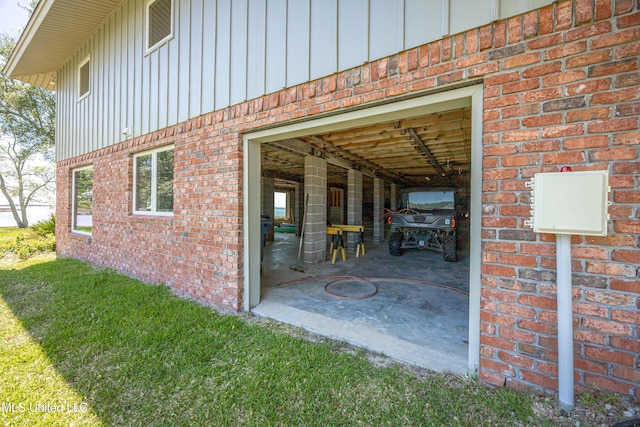 exterior space with brick siding and board and batten siding