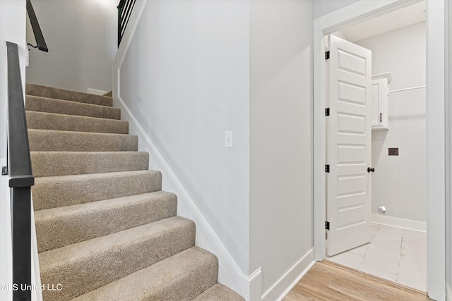 stairway featuring hardwood / wood-style floors