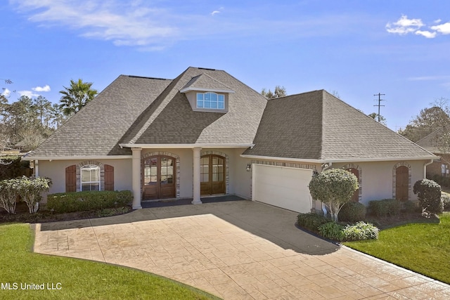 view of front of house featuring french doors and a garage