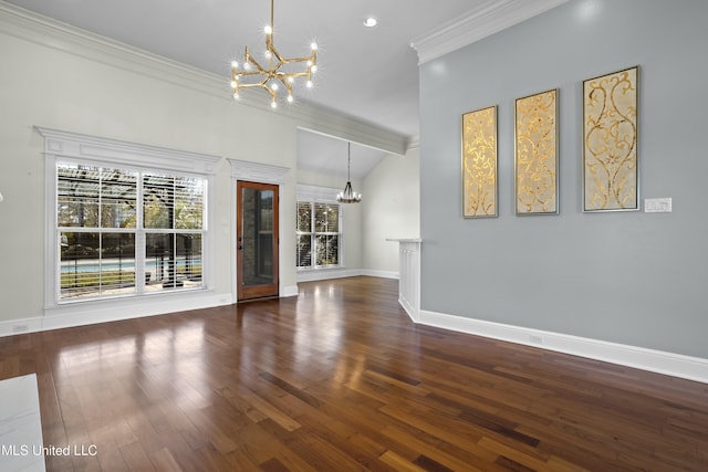 unfurnished living room with vaulted ceiling, dark hardwood / wood-style flooring, and an inviting chandelier