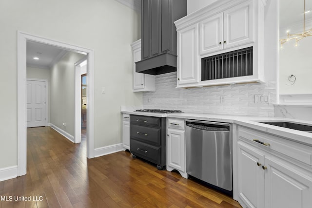 kitchen featuring backsplash, dishwasher, white cabinetry, and dark hardwood / wood-style floors