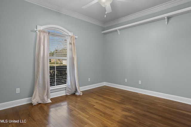 spare room with hardwood / wood-style flooring, crown molding, and ceiling fan