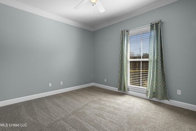 carpeted empty room featuring ceiling fan and ornamental molding