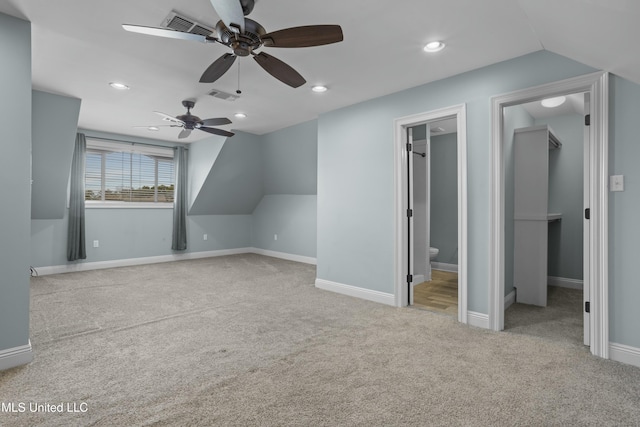 additional living space with light carpet, ceiling fan, and lofted ceiling